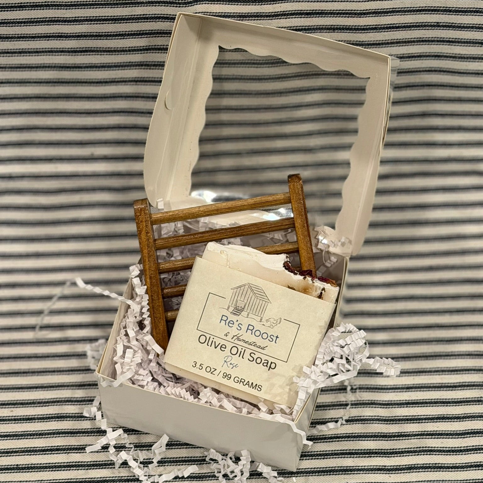 Set with Olive oil soap and soap rest in an open box with clear front