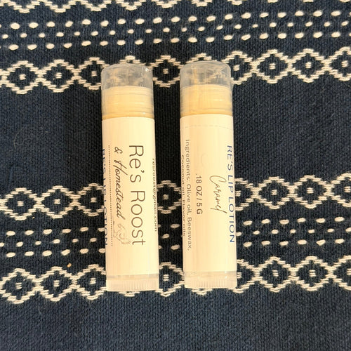 Lip lotions on blue cloth