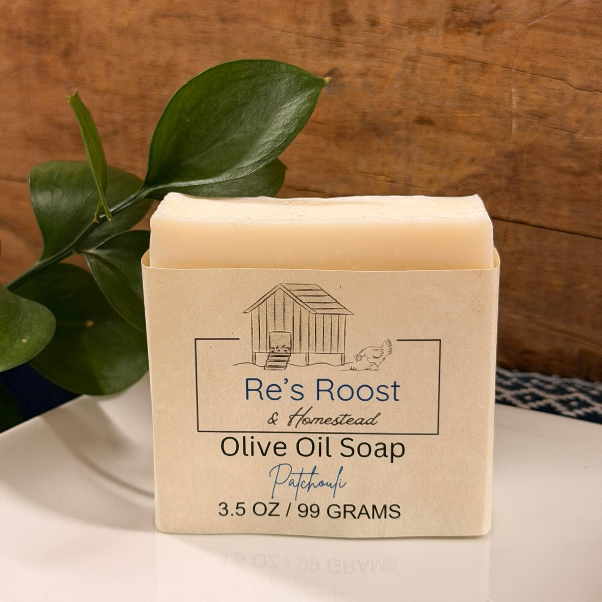 Patchouli scented bar of soap on white dish